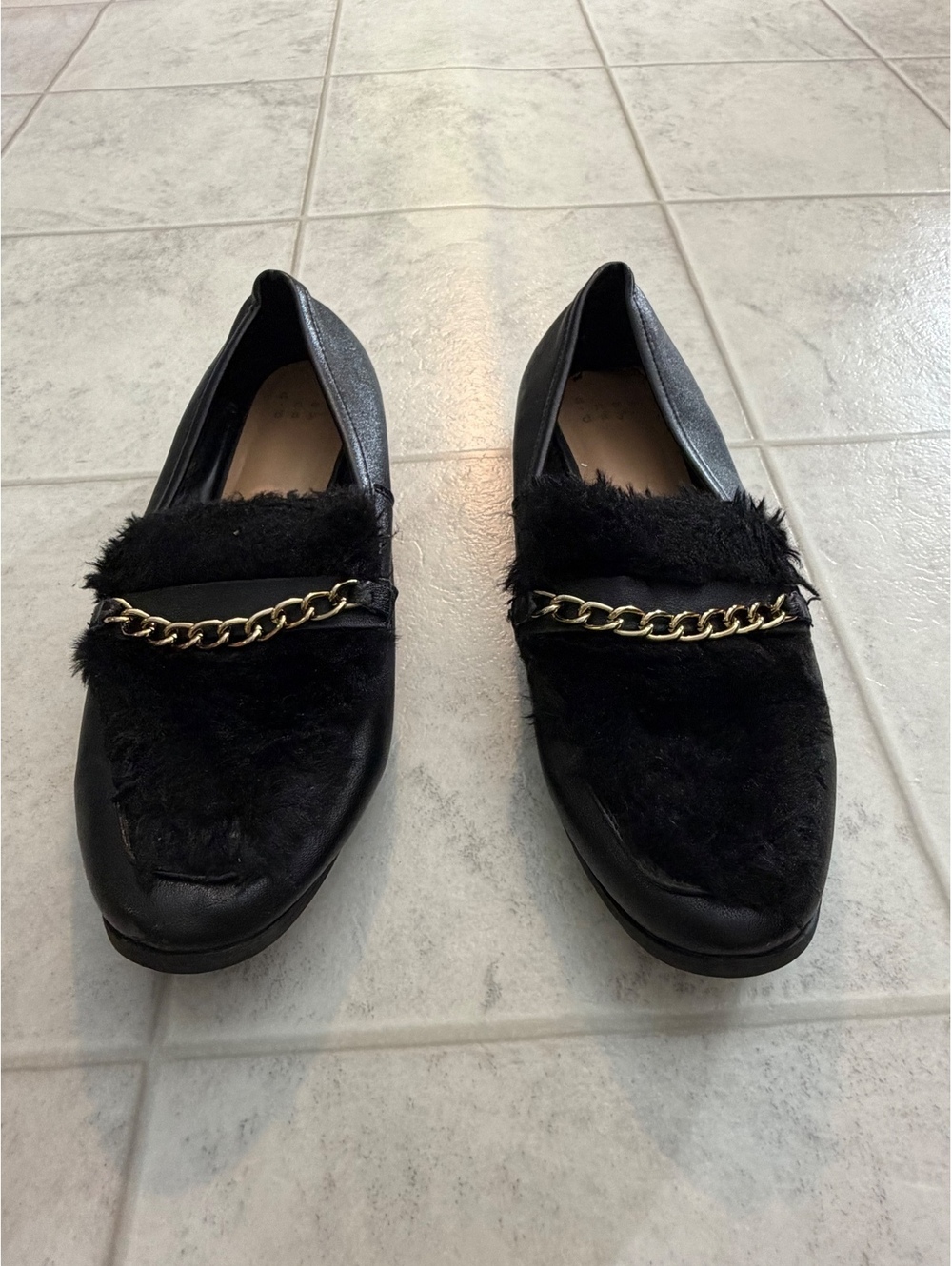 Black loafers with chain detail